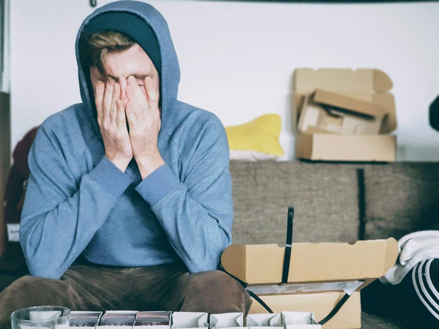 A tired man resting his head in his hands